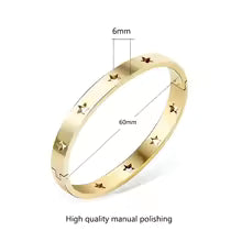 https://res.cloudinary.com/dyql5hig8/image/upload/v1743977217/config/images/gold_star_bracelet_cuff_yoqh0u.avif