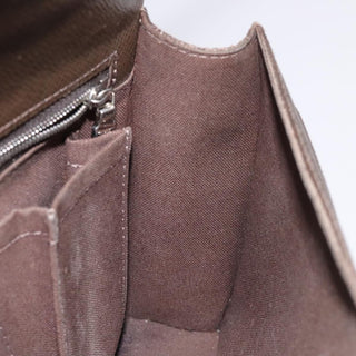 Louis Vuitton Belaia Clutch Taiga Leather