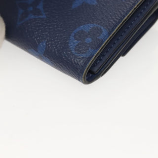 Louis Vuitton Discovery Wallet Monogram Taigarama